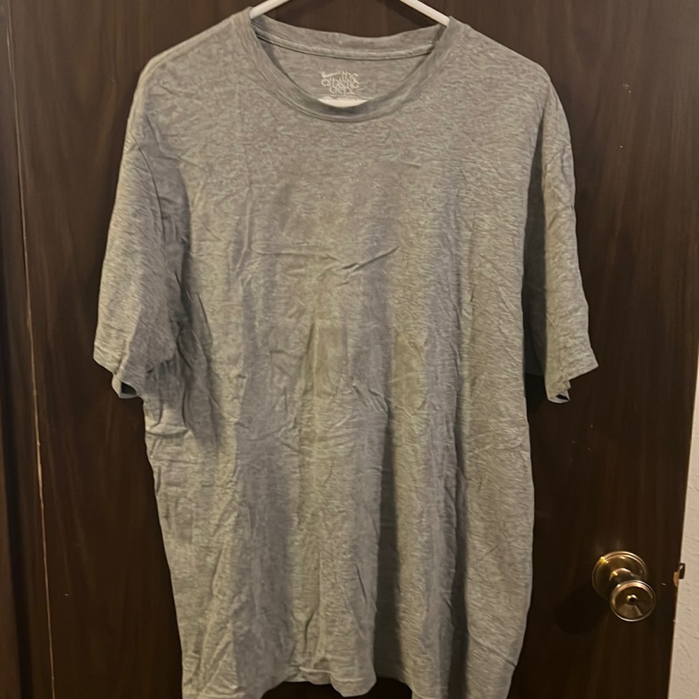Men’s Nike grey shirt sleeve shirt. Lightly says “cut the check”